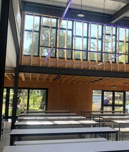 Featured image for Queen Elizabeth's Grammar School Dining Hall. Double height open plan interior with full width feature windows.