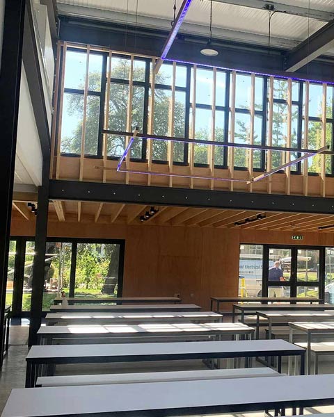 Featured image for Queen Elizabeth's Grammar School Dining Hall. Double height open plan interior with full width feature windows.