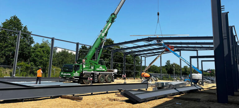 Photo of new industrial unit underway with steelframe under construction.