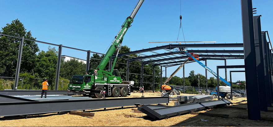 Photo of new industrial unit underway with steelframe under construction.