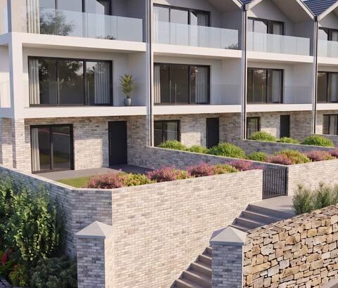 Artists impression of Roundham Mews, Paignton. A row of modern beachfront homes with balconies.